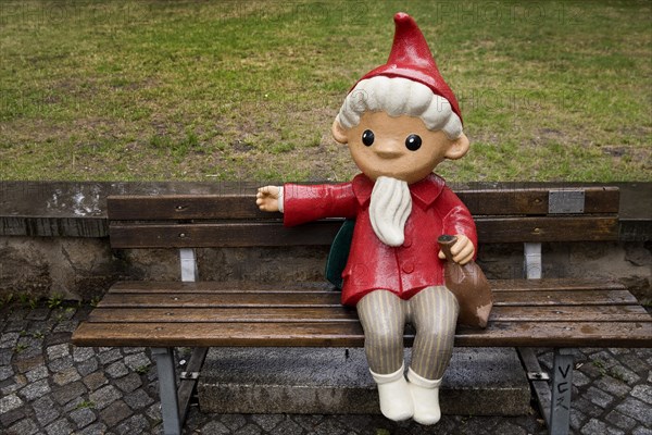 Sculpture of the Sandman on a bench