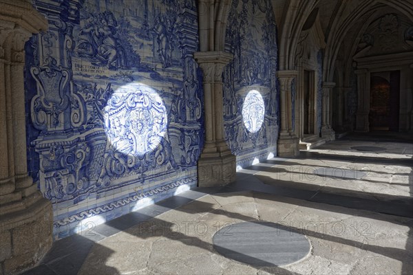 Light cones fall on wall with azulejo