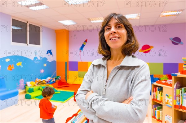 Portrait of a kindergarten or early childhood education teacher inside a kindergarten