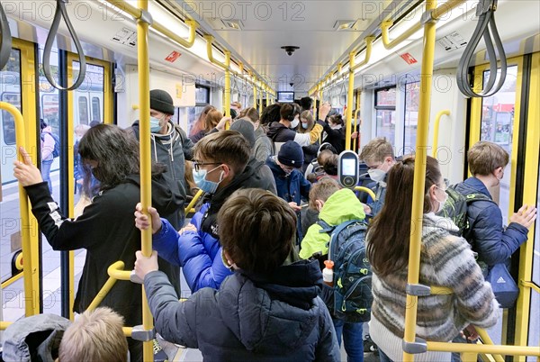 People in public transport. Keeping your distance is not possible in the tram