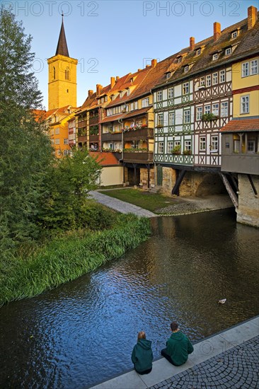 Half-timbered houses of the Kraemerbruecke with the river Gera and the Aegidienkirche