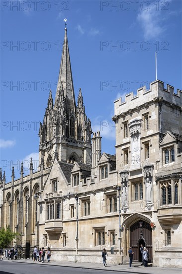 All Souls College on the right and St Mary's Church on the left on the High Street in the Old Town of Oxford