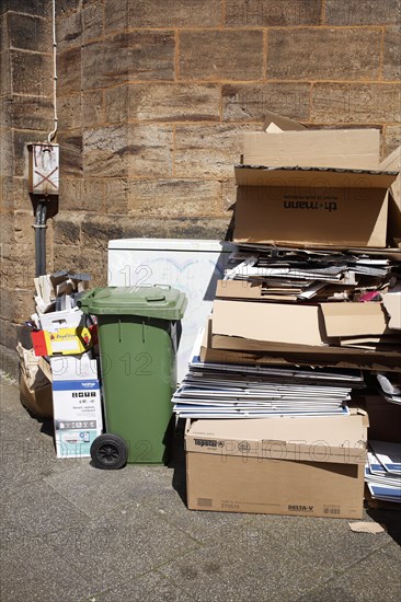 Cartons and stacks of waste paper