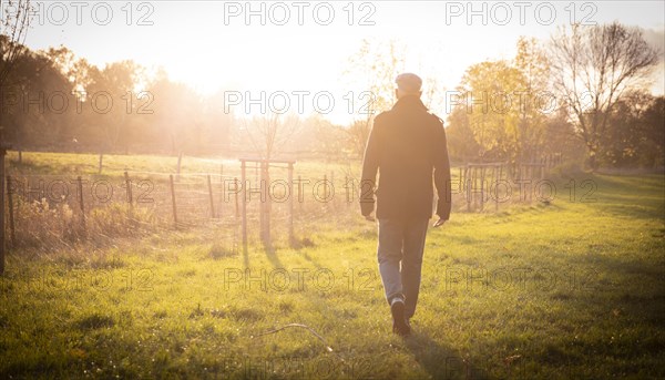 Man goes for an autumn walk alone