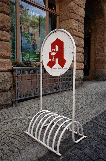 Bicycle stand with pharmacy logo