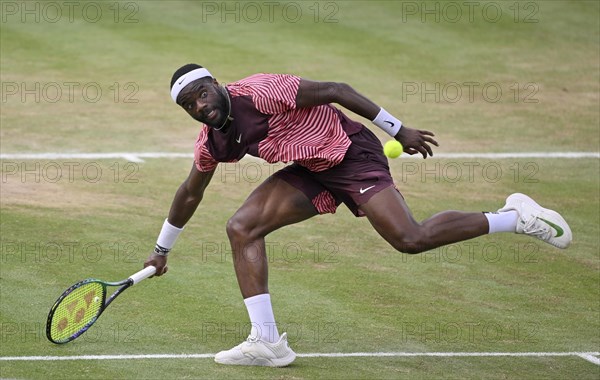 Frances Tiafoe USA converts his match point to win the title