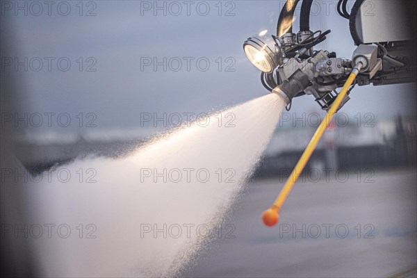 An aircraft is de-iced at Berlin-Schoenefeld BER Airport in Schoenefeld