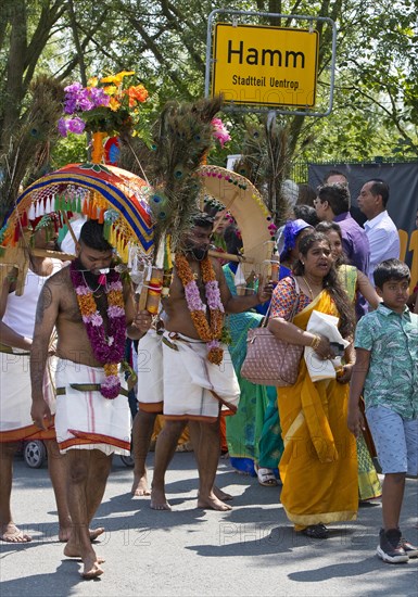 Hindus on the main festival day at the big parade Theer in front of the town sign of Hamm Uentrop