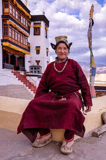 Elderly man in traditional Ladakhi clothes