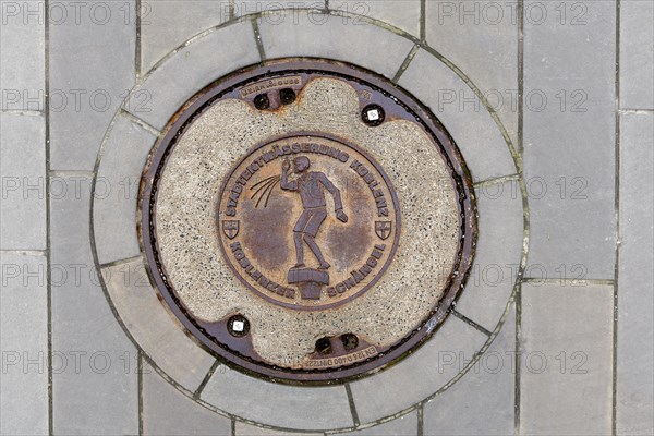 Manhole cover with the landmark Koblenz Schaengel