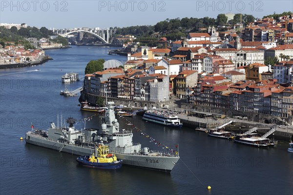 View of Ribeira district and Douro river with frigate NRP D. Francisco da Almeida