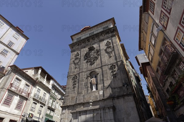 Monumental fountain Fonte da Praca da Ribeira with modern sculpture St. John the Baptist