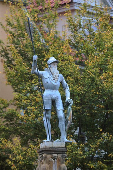 Historic hop fountain built 1573 with knight in armour with lance and shield