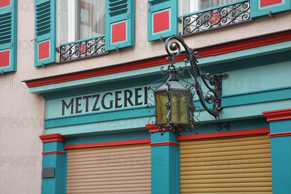 Street lamp and inscription Metzgerei am Fachwerkhaus