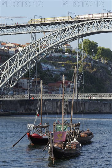 Historic barges with port wine barrels on the Douro River