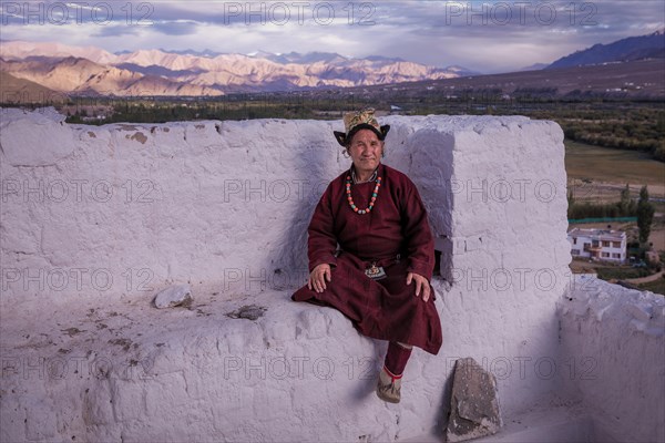 Elderly man in traditional Ladakhi clothes