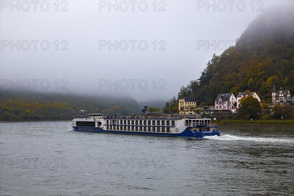 River cruise ship in fog in St. Goar at the Loreley