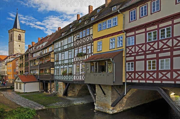 Half-timbered houses of the Kraemerbruecke with the river Gera and the Aegidienkirche