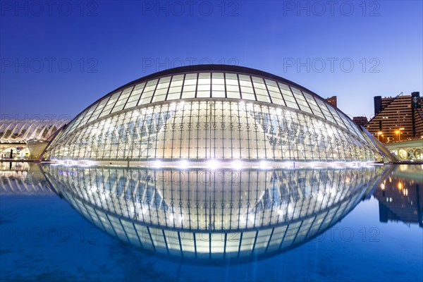 Ciutat de les Arts i les Ciencies with Hemisferic building modern architecture by Santiago Calatrava at night in Valencia