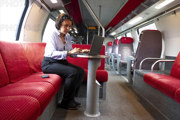 Business woman sitting in first class train