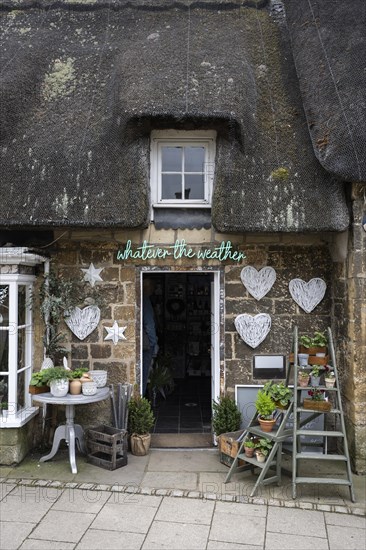 Historic stone house with thatched roof in detail