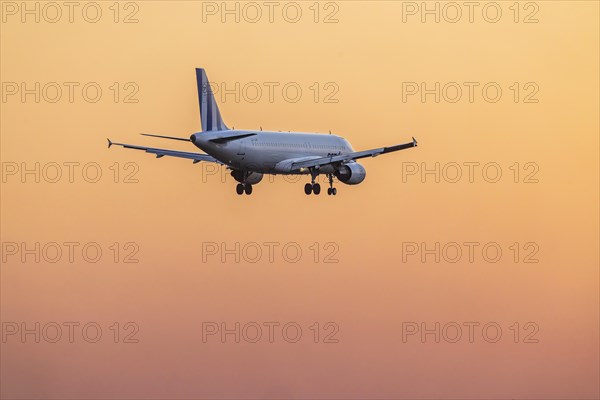 Aircraft on approach in the early morning