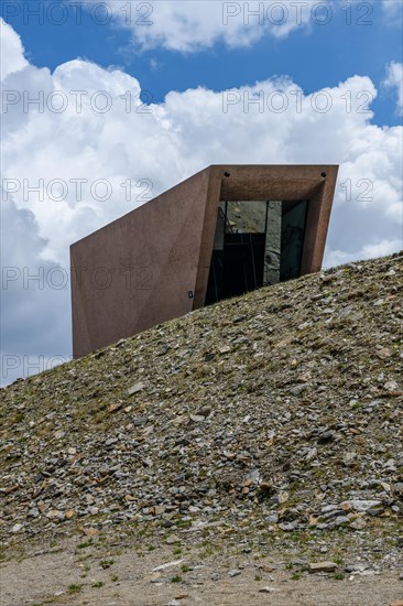 View of entrance of Pass Museum rising to 2509 metres high Timmelsjoch Passo Rombo from right Austrian territory Tyrol to left in air of Italian territory South Tyrol