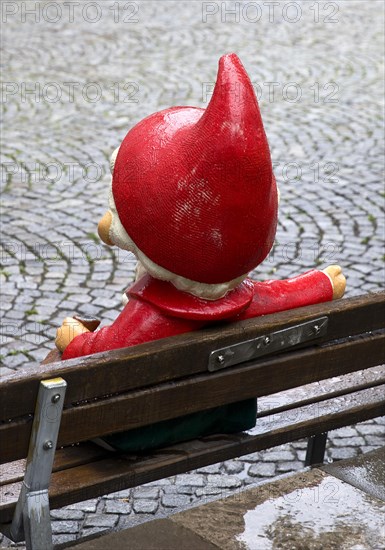 Sculpture of the Sandman on a bench