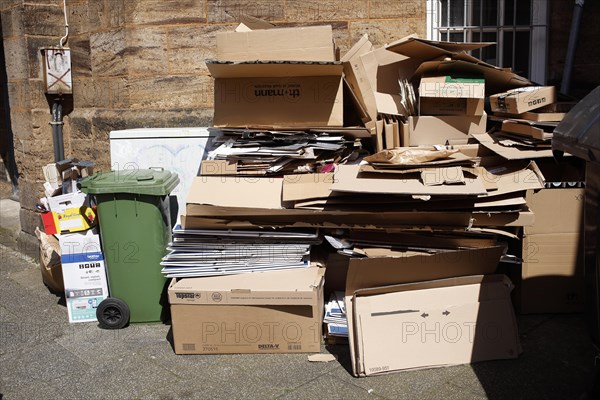 Cartons and stacks of waste paper