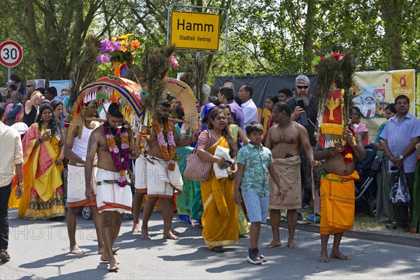 Hindus on the main festival day at the big parade Theer in front of the town sign of Hamm Uentrop