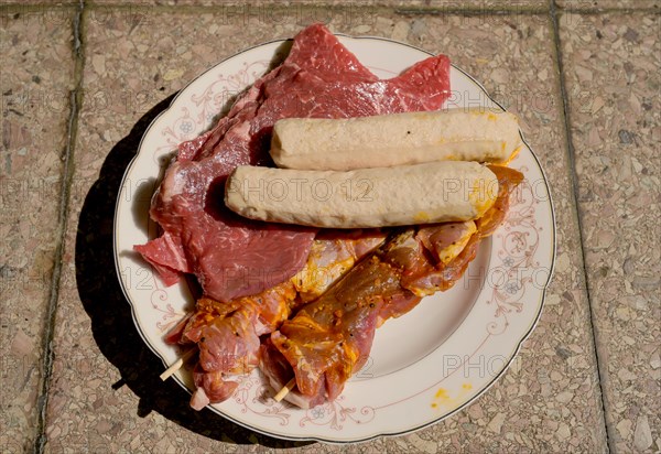 Plate with meat and grilled food