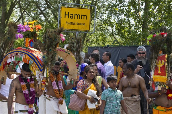 Hindus on the main festival day at the big parade Theer in front of the town sign of Hamm Uentrop