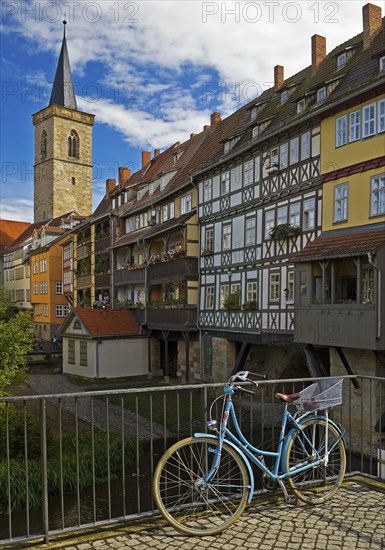 Half-timbered houses of the Kraemerbruecke with the river Gera and the Aegidienkirche