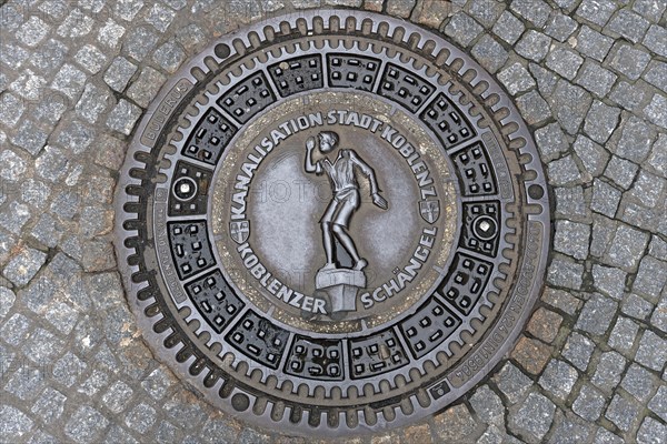 Manhole cover with the landmark Koblenz Schaengel