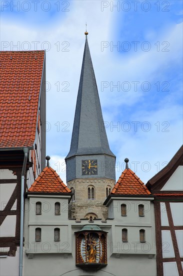 Historic home playhouse and church tower of St. Maria Magdalena