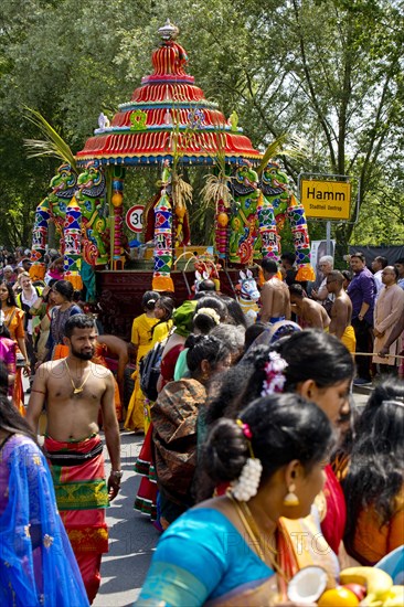 Hindus on the main festival day at the big parade Theer in front of the town sign of Hamm Uentrop