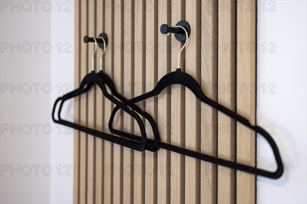 Coat rack with coat hooks.