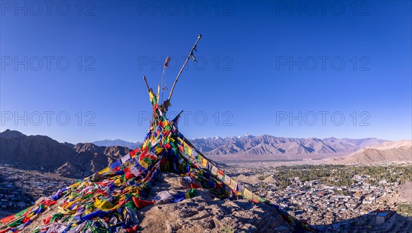 Buddhist prayer flags with Leh in the background