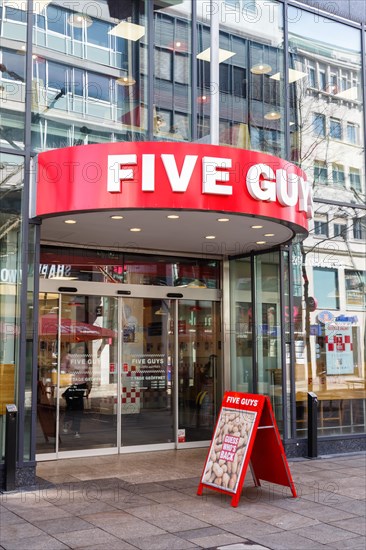 Five Guys brand fast food hamburger restaurant with logo on Koenigstrasse in Stuttgart
