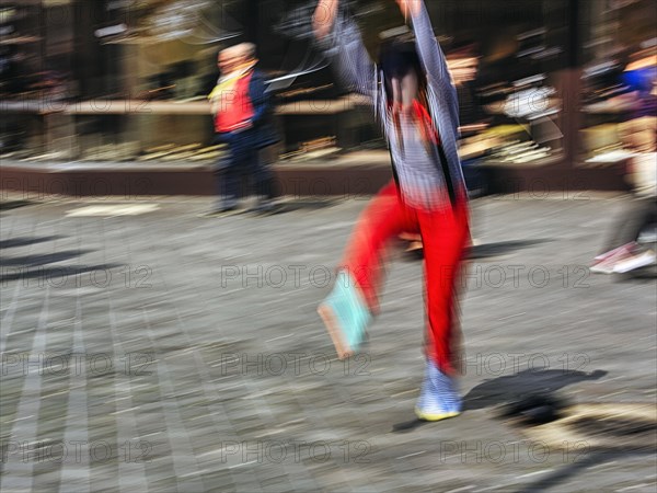 Colourful clown beats a wheel