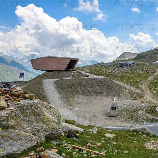 View on the left Pass Museum rises on pass height of 2509 metres high Timmelsjoch Passo Rombo from right Austrian territory to left in air of Italian territory