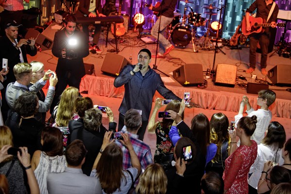 Singer-songwriter Andreas Bourani at a concert on stage