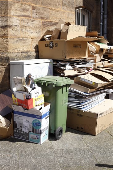 Cartons and stacks of waste paper