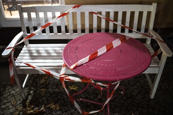 Barricaded tables and benches at a cafe in Berlin