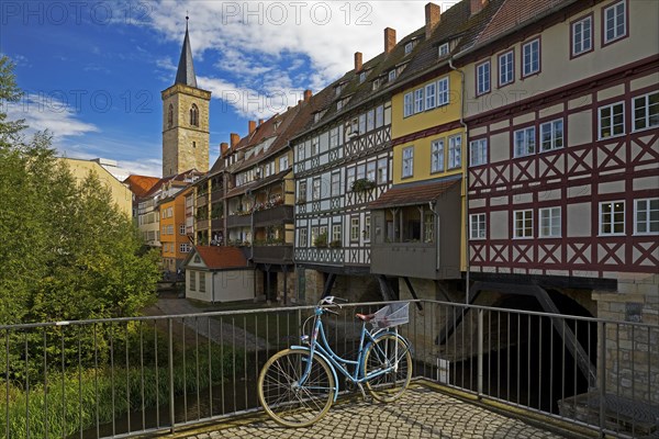 Half-timbered houses of the Kraemerbruecke with the river Gera and the Aegidienkirche