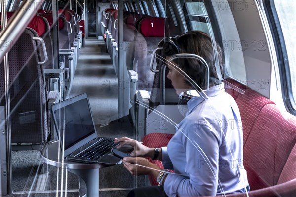 Business woman sitting in first class train