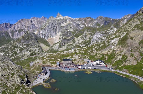 View from the Great St. Bernard Pass over the mountain lake Lac du Grand-St-Bernard to the Italian Alps with the peak Pain de Sucre in Italy