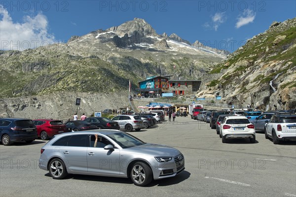 Busy car park at the entrance to the ice grotto in the Rhone glacier