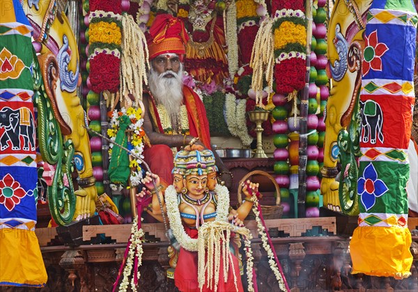 Priest Arumugam Paskaran at the main festival day during the big procession Theer