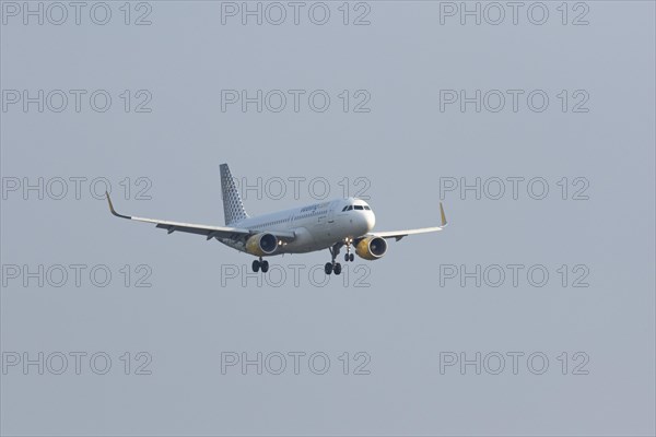 Passenger aircraft Airbus A320-200 of the airline Vueling on approach to Hamburg Airport